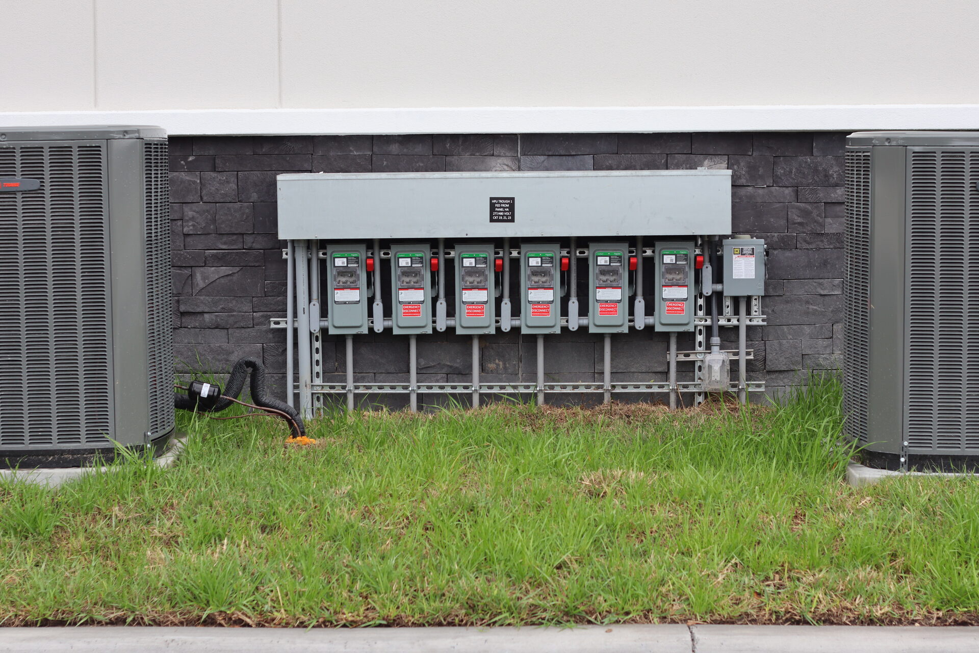 Commercial meter bank installation on a building exterior