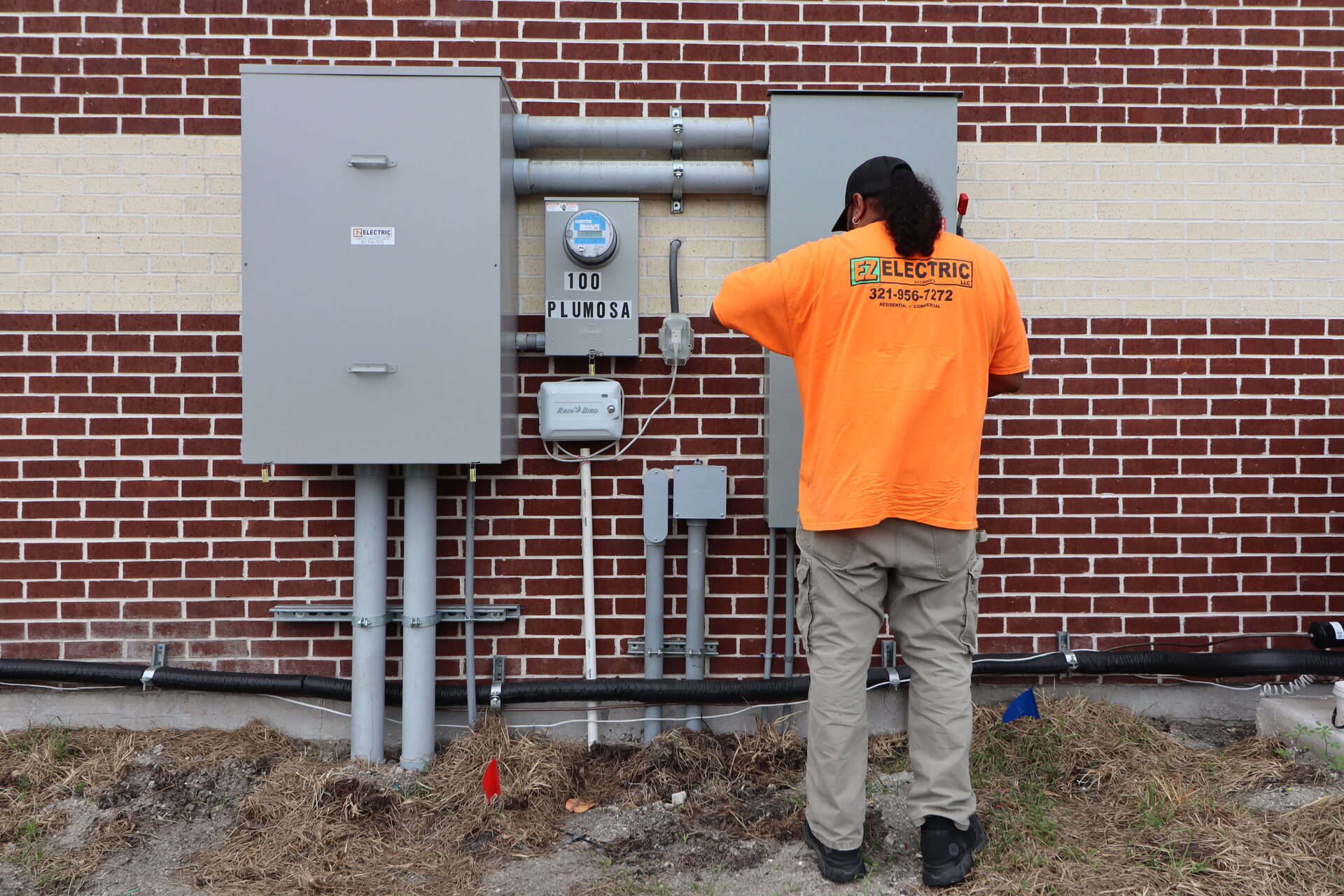 EZ Electric technician installing an electrical panel